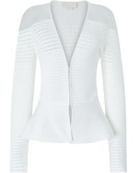 Genny - Cardigan mit Schößchen - Lyst