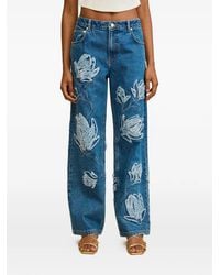 Cult Gaia - Floral-Appliqué Frayed Jeans - Lyst
