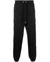 Moncler - Pantaloni sportivi con righe laterali - Lyst