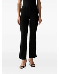Guess - Logo-Patch Flared Jeans - Lyst