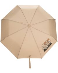 Moschino Regenschirm mit Logo-Print in Lila Damen Accessoires Regenschirme 