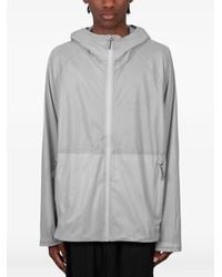 Optimistic Runners - Packable Hooded Jacket - Lyst