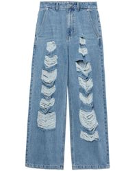 SJYP - Jeans a gamba ampia - Lyst