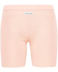 Miu Miu - Shorts con parche del logo - Lyst