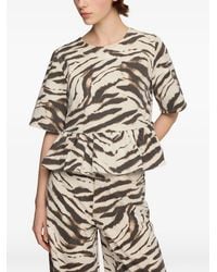 Ganni - Blouse À Basque Et Imprimé Zébré - Lyst
