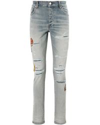 Amiri - Vaqueros Skinny Travel Patch Repair - Lyst