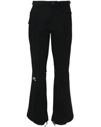 Balenciaga - Ausgestellte Hose mit Logo-Print - Lyst