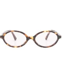 Miu Miu - Tortoiseshell-Effect Oval-Frame Sunglasses - Lyst