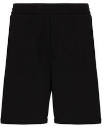 Alexander McQueen - Pantalones de chándal con franjas del logo - Lyst
