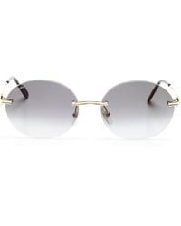 Cartier - Gafas de sol con montura oval metalizada - Lyst