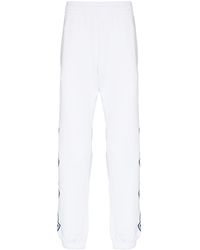 Moncler - Pantalones de chándal con logo lateral - Lyst