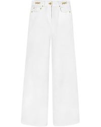 Versace - Mid-Rise Flared Jeans - Lyst