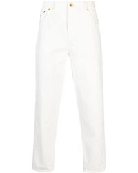 Brunello Cucinelli - Logo-embroidered Tapered Cotton Jeans - Lyst