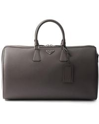 Prada - Bolso de viaje de piel saffiano - Lyst