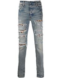 Amiri - Ripped-Detail Jeans - Lyst