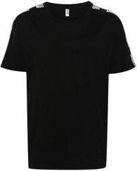 Moschino - Camiseta con franjas del logo - Lyst