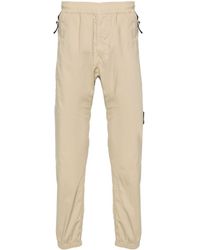 Stone Island - Pantalones ajustados con distintivo Compass - Lyst