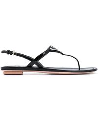 Prada Sandalias planas con placa del logo - Negro