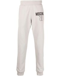 Moschino - Logo Print Tapered Sweatpants - Lyst