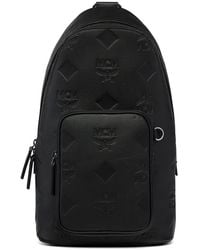 MCM - Aren Embossed Monogram Messenger Bag - Lyst