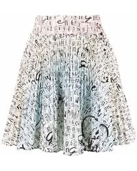 Genny - Logo-print Pleated Skirt - Lyst