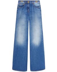 Versace - Mid Waist Flared Jeans - Lyst