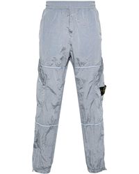 Stone Island - Compass-motif Shell Trousers - Lyst