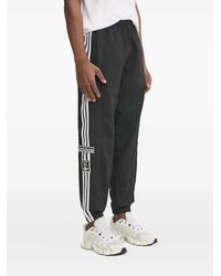 adidas - Pantalones de chándal con tres rayas - Lyst