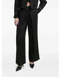 Isabelle Blanche - Pleated Buckle-Detail Trousers - Lyst