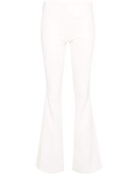 Courreges - Logo-embroidered Bootcut Trousers - Lyst