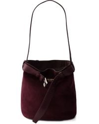 Prada - Buckle Belted Suede Bucket Bag - Lyst