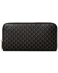 Calvin Klein - Monogram-Print Zip-Around Wallet - Lyst