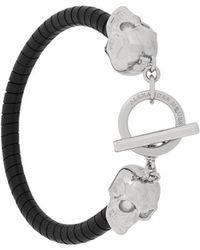 Alexander McQueen Pulsera con detalle de calavera - Negro