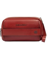 Piquadro - Logo-Plaque Leather Clutch Bag - Lyst