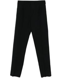 Givenchy - Wool pleated-front trousers - Lyst