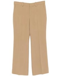 TOTEME - Kick Pressed-Crease Flared Trousers - Lyst