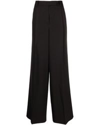 Versace - Pantalones anchos con pinzas - Lyst