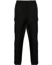Neil Barrett - Pressed-Crease Tapered Trousers - Lyst