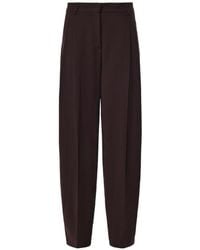 ANDAMANE - Pleated Tapered Trousers - Lyst