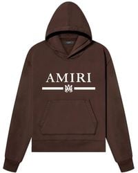 Amiri - Logo-Print Pouch-Pocket Hoodie - Lyst