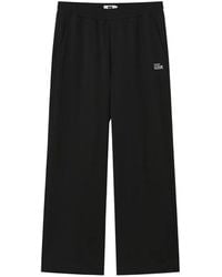 Izzue - Logo-Embroidered Trousers - Lyst