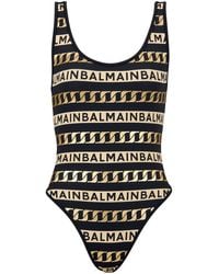Balmain - Gestreifter Badeanzug mit Logo-Print - Lyst
