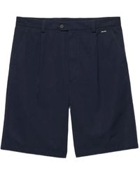 Prada - Logo-Embroidered Front-Pleated Shorts - Lyst