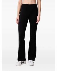 Sporty & Rich - Beck Bold Logo-Print Flared Leggings - Lyst