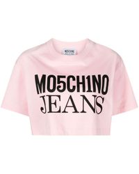 Moschino Jeans - Haut crop en coton à logo imprimé - Lyst