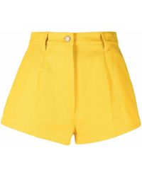 Prada - Pantalones cortos con logo triangular - Lyst
