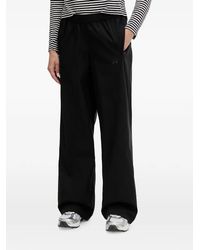 Under Armour - Unstoppable Woven Logo-Print Wide-Leg Track Pants - Lyst