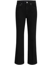 KHAITE - Flared-Leg Cotton Jeans - Lyst