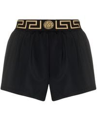 Versace - Shorts con cinturilla Greca - Lyst