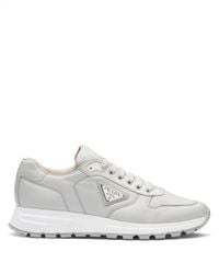 Prada - Logo-Plaque Low-Top Sneakers - Lyst